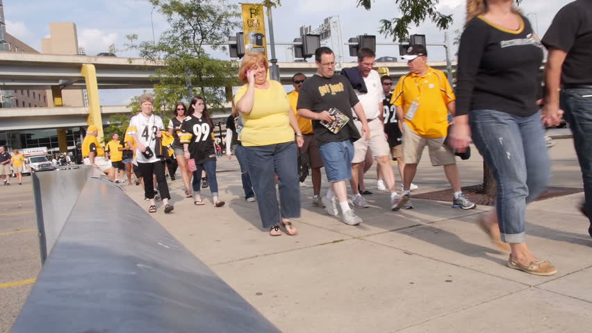 PITTSBURGH, PA, Circa August, 2013 - Sports fans walk to Heinz Field at the