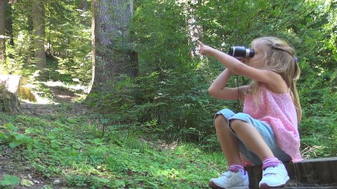 Child Looking in Binocular, Spyglass in Mountains Forest , Tourist Girl in Trip
