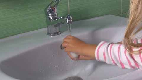 Child, Little Girl, Washing Hands with Soap and Water in Bathroom Sink, Children