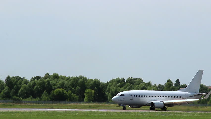 Middle-sized aircraft Boeing 737-500 steering on the runway