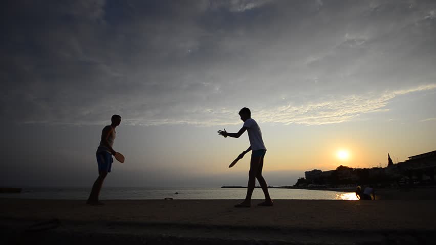 Enjoying the beach lifestyle, Beautiful gays having fun on the beach at sunset