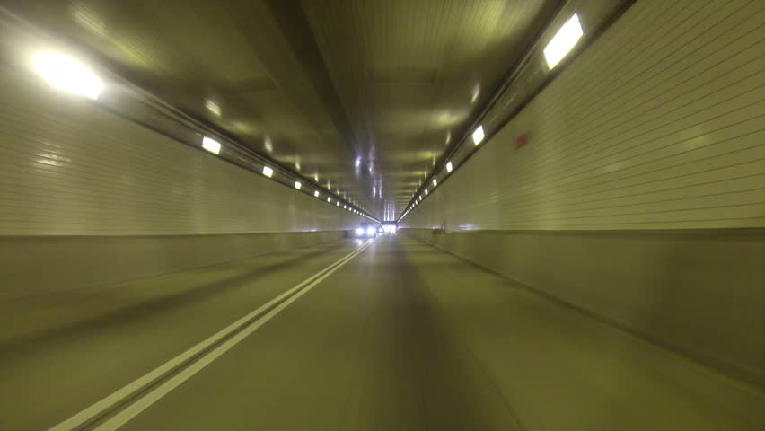 A rear view perspective of driving into the Fort Pitt Tunnel in Pittsburgh,