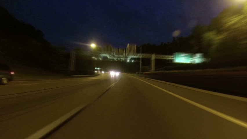 A time lapse rear view perspective of driving into the Fort Pitt Tunnel in