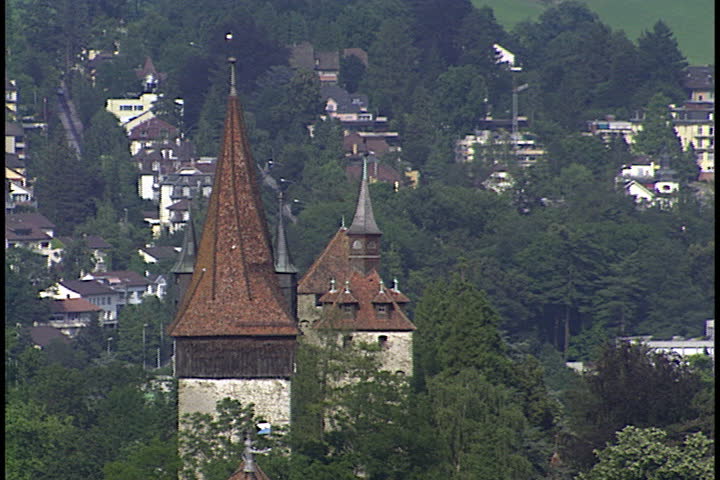 WS of Lucerne with harbor, boats, houses, towers, hills and mountains in Lucerne, Switzerland .