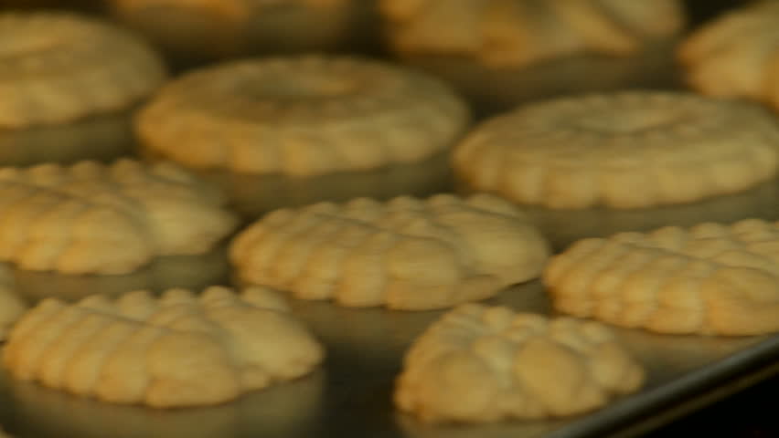 Close up view of cookies coming out of the oven.