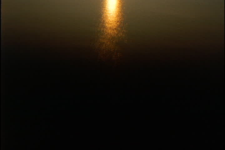 Golden sunset reflected on the surface of the Mississippi River.