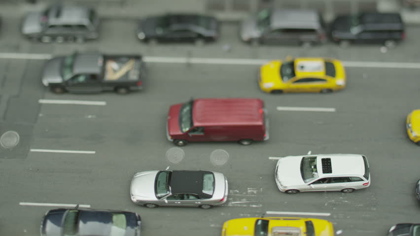 Overhead view of queuing traffic on a busy New York street. In slow motion.
