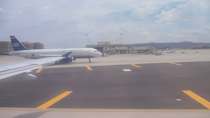 PHOENIX, ARIZONA AIRPORT - CIRCA 2013: US Airways airplane arrives in Phoenix,