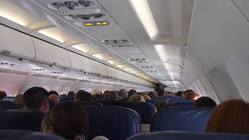 US AIRWAYS INTERIOR FLIGHT - CIRCA 2013: Flying in airplane, point of view as