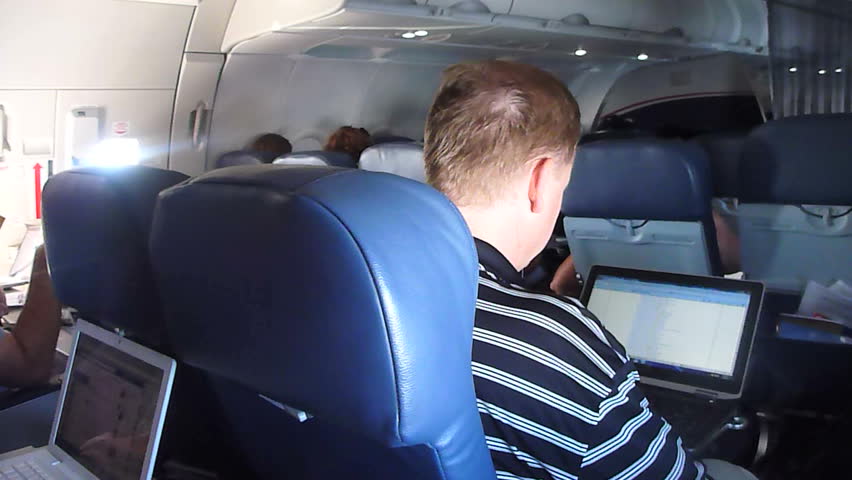 US AIRWAYS INTERIOR FLIGHT - CIRCA 2013: Flying in airplane, point of view as