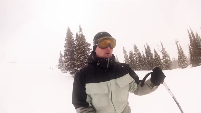 Downhill skiing at a beautiful mountain ski resort after a fresh snowfall
