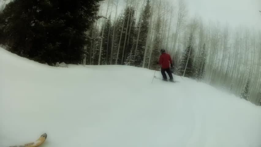 Downhill skiing at a beautiful mountain ski resort after a fresh snowfall