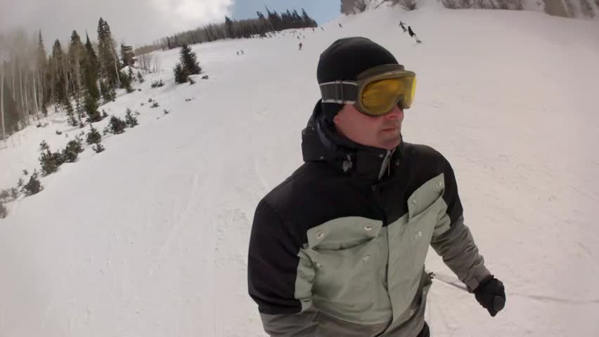Downhill skiing at a beautiful mountain ski resort after a fresh snowfall