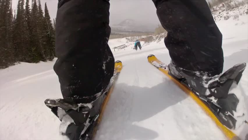 Downhill skiing at a beautiful mountain ski resort after a fresh snowfall