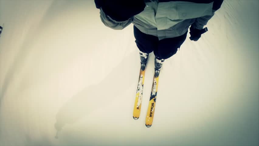 Downhill skiing at a beautiful mountain ski resort after a fresh snowfall