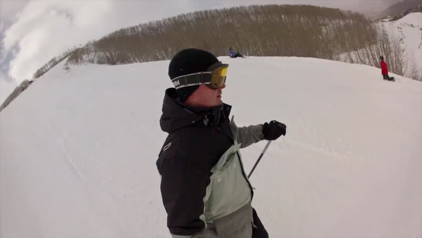 Downhill skiing at a beautiful mountain ski resort after a fresh snowfall
