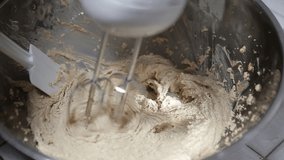 beating the flour preparation for oats cookies 