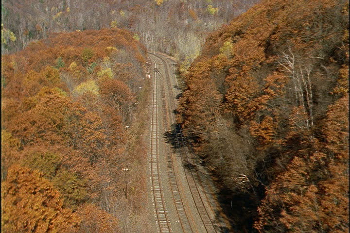 Aerial shot follows railroad tracks leading through the woods to the Hoosac Tunnel in North Adams, Massachusetts.