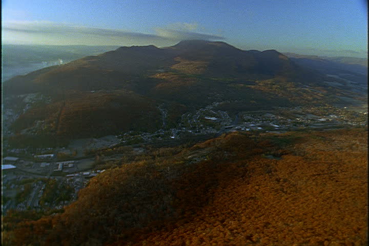 Aerial shot over North Adams with the Green Mountains behind in North Adams, Massachusetts.