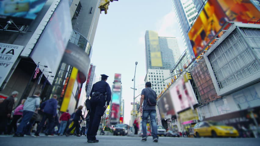 Crowds of tourists gather at Times Square in New York City.