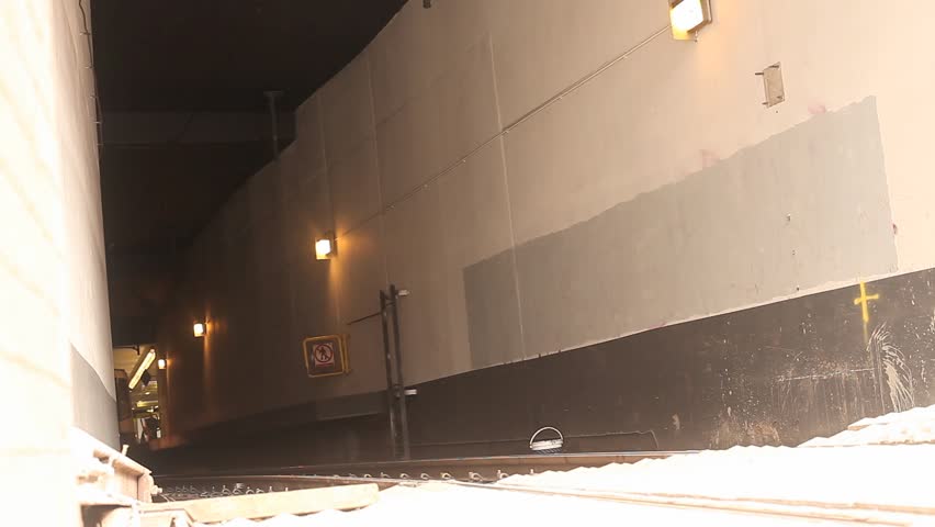 A tram exits its subway station. Manchester, England