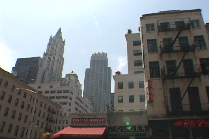 Time lapse in Manhattan, New York City, downtown with buildings and people.