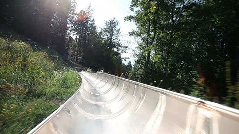 Young man is driving with camera in bobsled pov