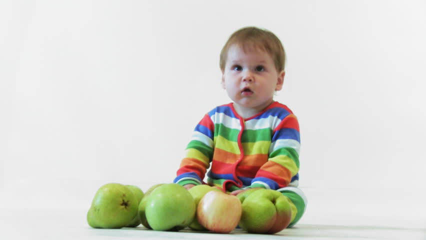 Adorable child with apples