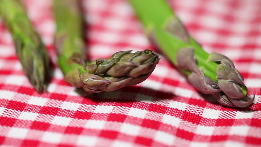 asparagus on red tablecloth