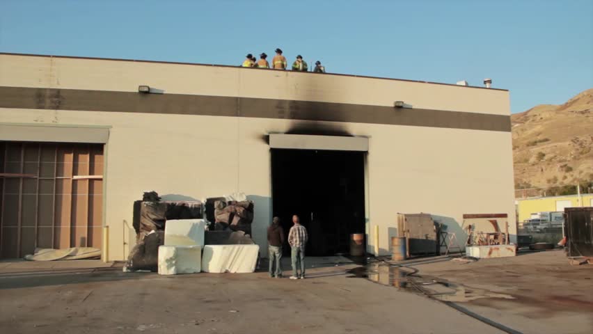 Firefighters fighting a warehouse fire