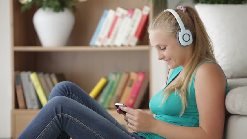 Lovely girl listening music and using cellphone