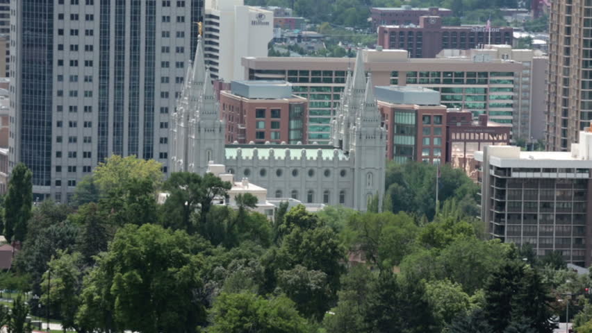 Salt Lake City Mormon Temple summer haze. Salt Lake City Utah urban center with capital building area and famous historic LDS Temple Square. Distant with summer heat shimmer. Metropolitan center