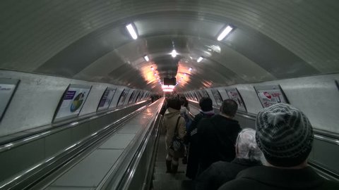 TBILISI, GEORGIA - 18 APRIL 2013: Subway passengers are moving down on escalators in the metro of Tbilisi, Georgia