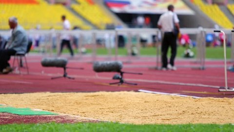MOSCOW - JUN 11: Sportswoman does length jump to sandpit at Grand Sports Arena of Luzhniki OC during international athletics competitions IAAF World Challenge on 11 June 2012, Moscow, Russia.