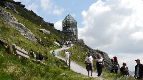 GROSSGLOCKNER, AUSTRIA - JULY 21 2013: People walking to an observation point at Grossglockner High Alpine Road (Salzburg, Austria)