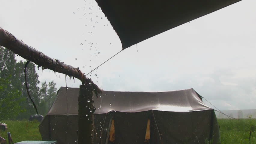 Heavy rain falling on a tent