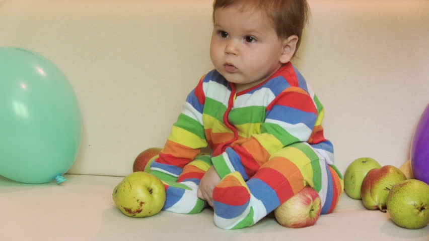 Adorable child with apples