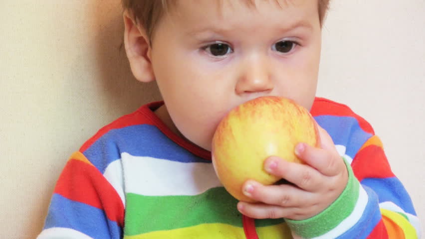 Adorable child with apples