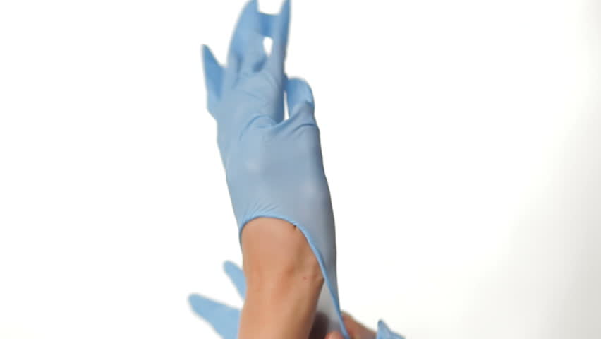Hands puling on gloves on white background