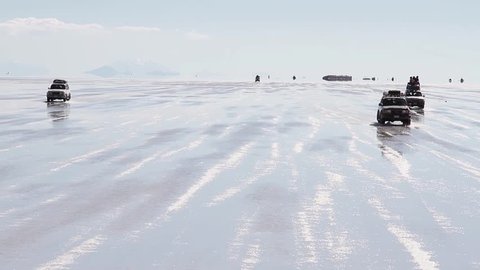 Salar Uyuni salt desert Bolivia cars Stock Video