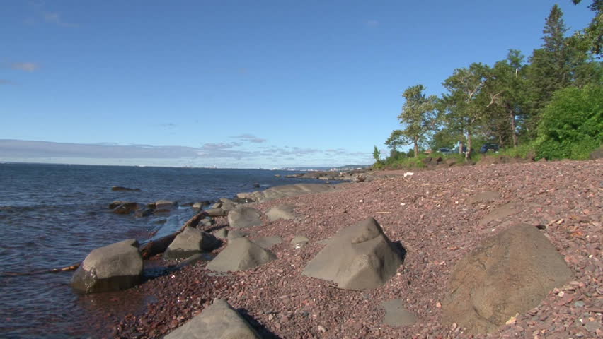 Lake Superior scenic on sunny, blue sky day, zoom in to downtown Duluth Minnesota and Canal Park.