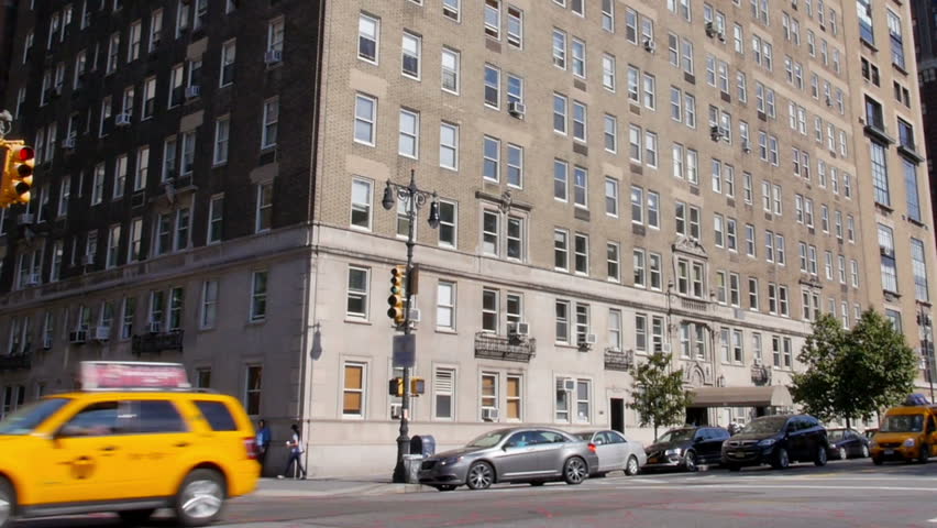 A typical daytime New York City apartment building establishing shot.