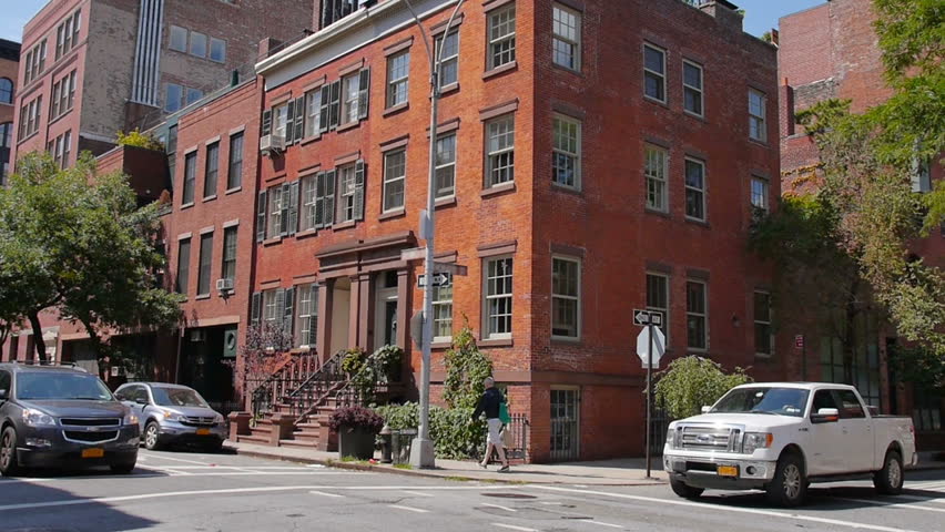 A typical daytime New York City apartment building establishing shot.