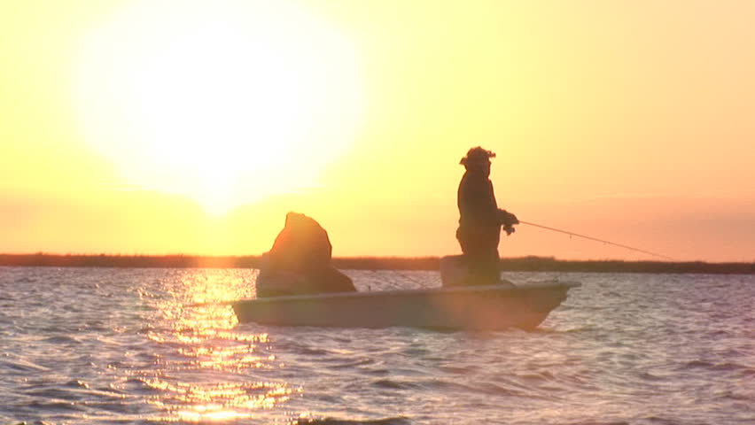 Fishing at sunrise in Louisiana Marsh