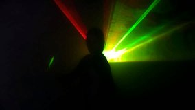 Woman in a nightclub dances in laser light. High quality HD video footage