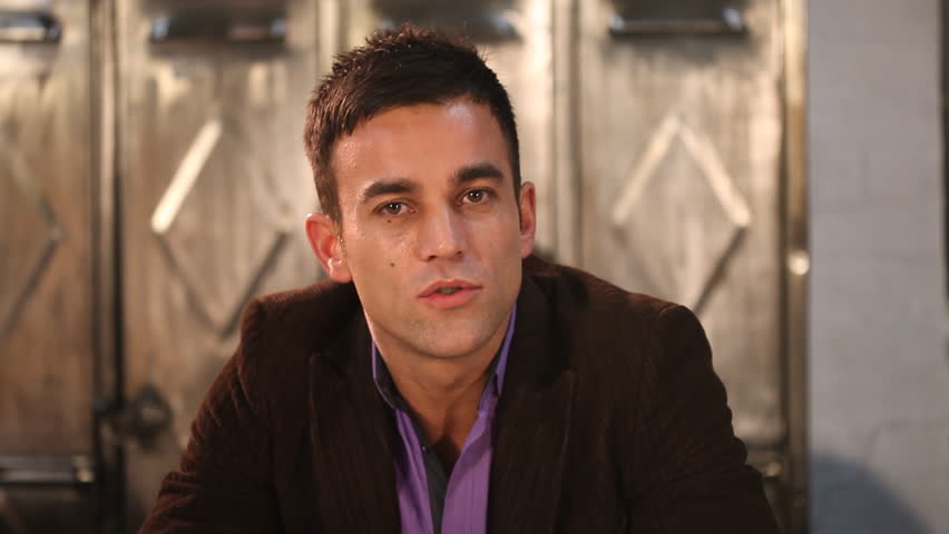 Talking to camera as if being interviewed or using computer or mobile camera to communicate. High quality HD video footage