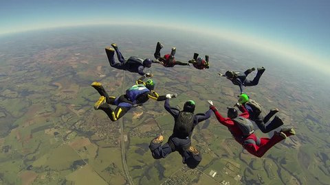 Skydiving big free fall formation over countryside of Brazil