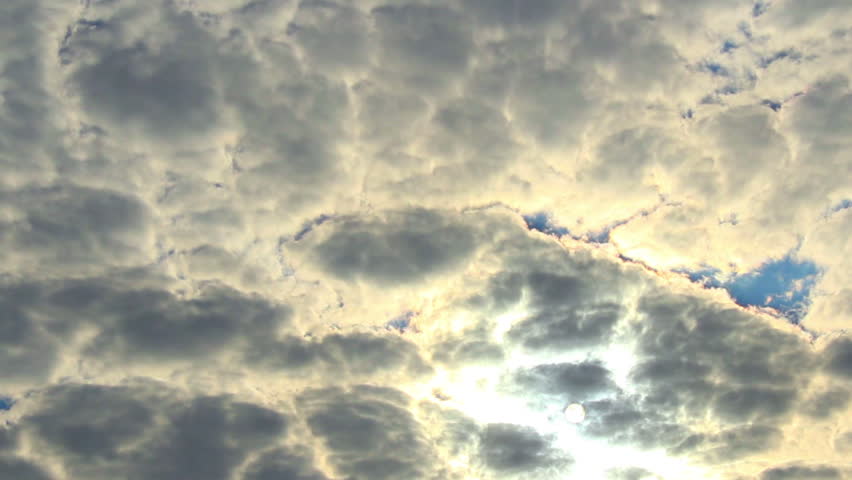 Cloud timelapse sun rays through cloudy sky