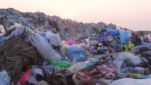 DOLLY: Urban Refuse Dump At Sunset