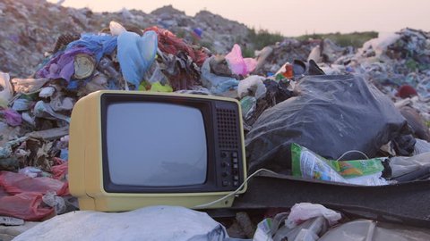 Стоковое видео: DOLLY: Old TV in Landfill